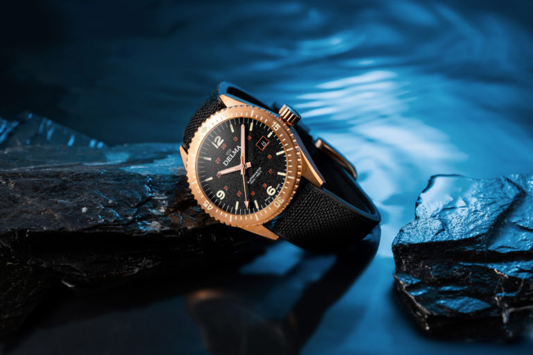 Delma Cayman Bronze with black dial with rocks and water